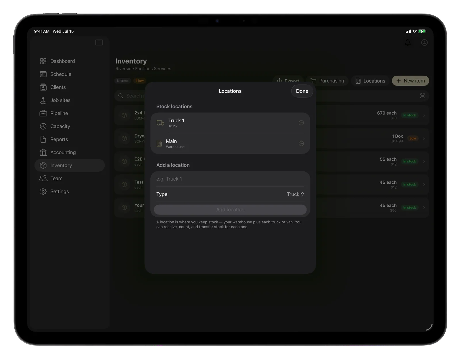 CRMb stock locations on iPad: a warehouse and trucks, with a new truck being added
